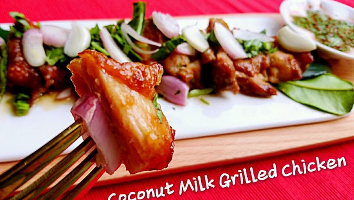 Thai cuisine: Coconut flavored roasted chicken leg with dipping sauce and sweet vinegar sauce