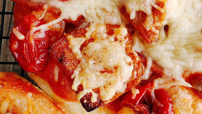 Oiled tomato sausage pizza