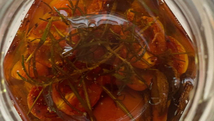 Soak cherry tomatoes in oil
