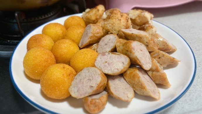 Family simple snack set, fried chicken nuggets, German sausage, sweet potato and taro balls